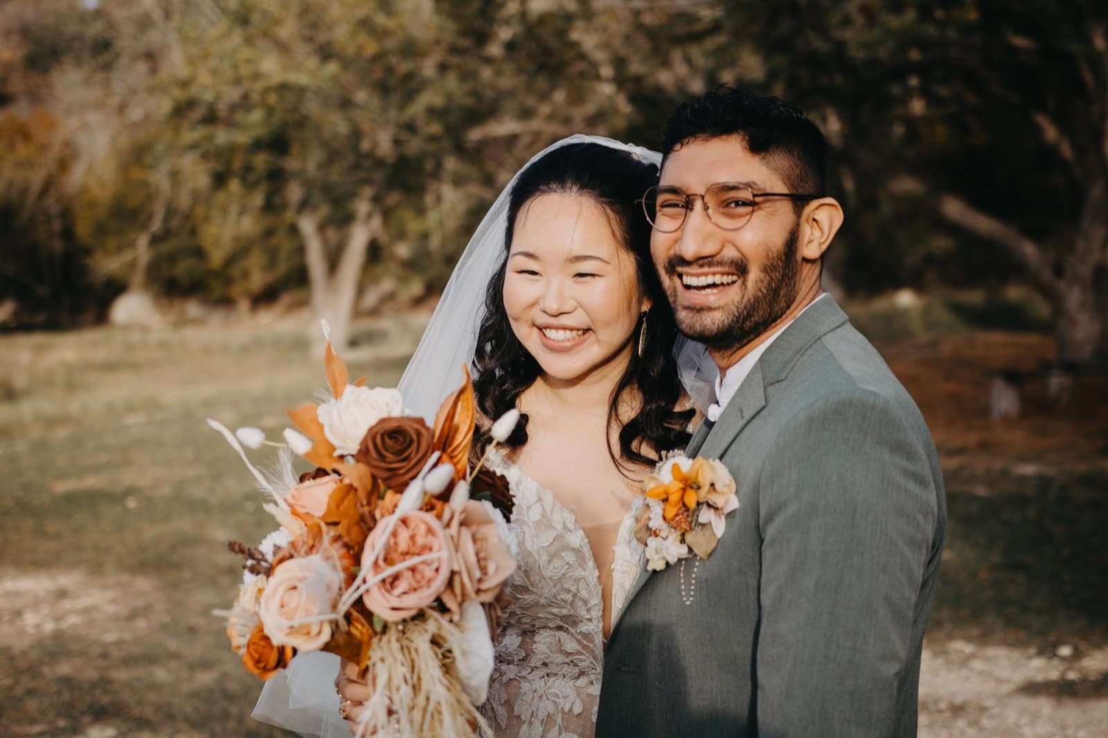 Bride smiling with her groom