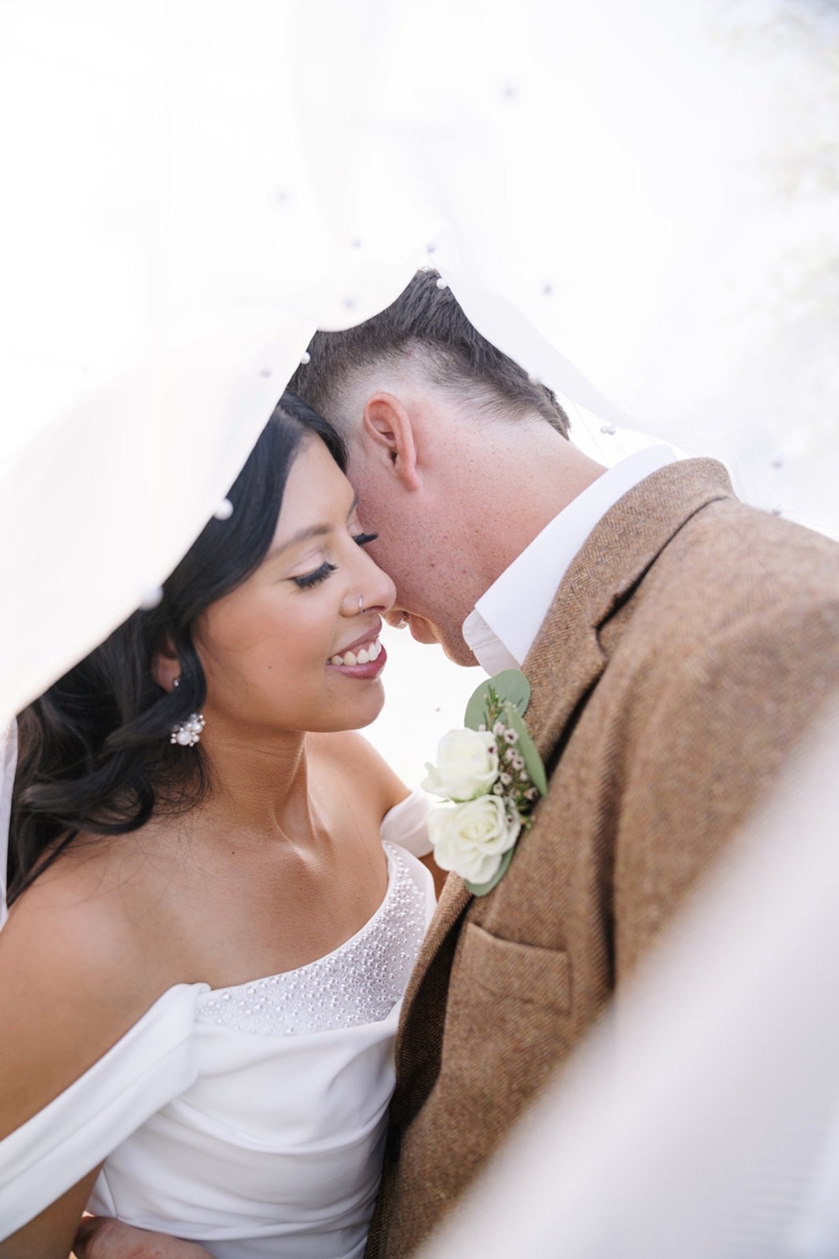 Bride and groom sharing a joyful moment