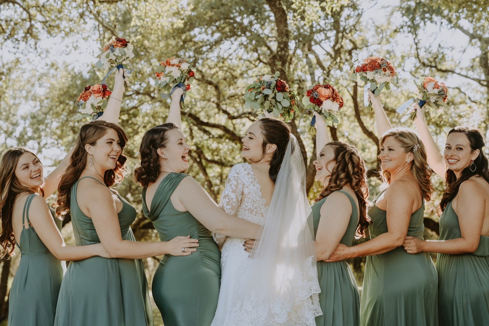 Bride celebrating with her wedding party